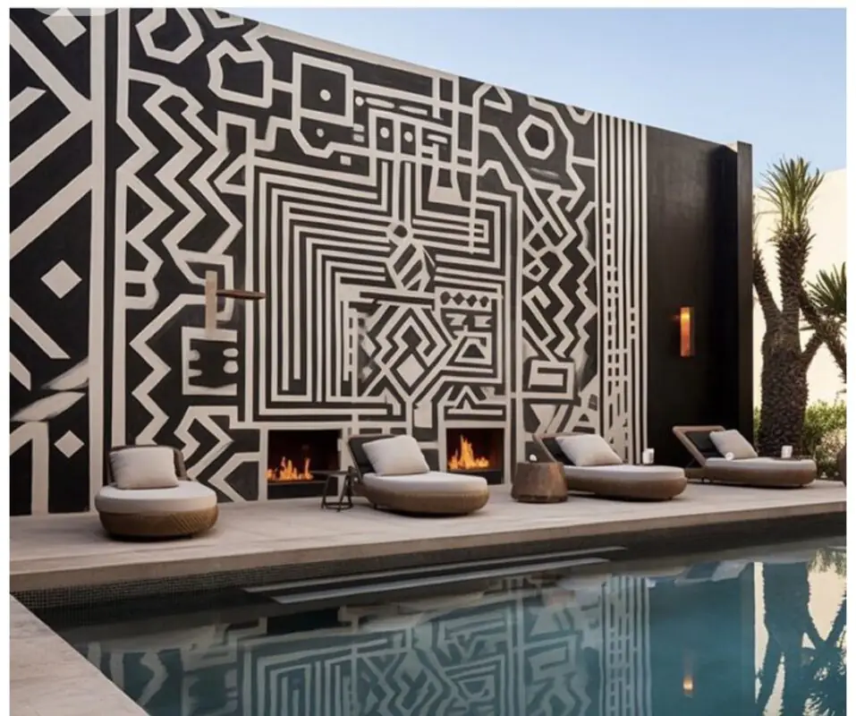 Poolside lounge area with geometric mural wall and fire feature