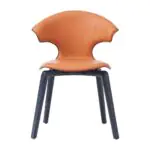 Taurus Winged Leather Chair - a flared orange leather back on dark curved legs