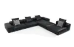 Noct L-Shaped Sofa - black leather sections with a matching ottoman corner